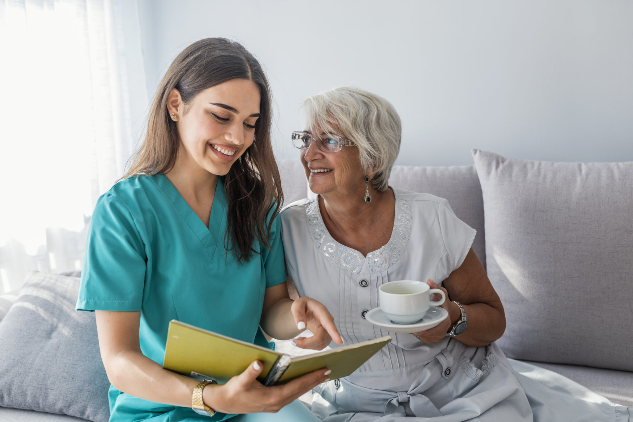 Nurse sitting with a senior woman